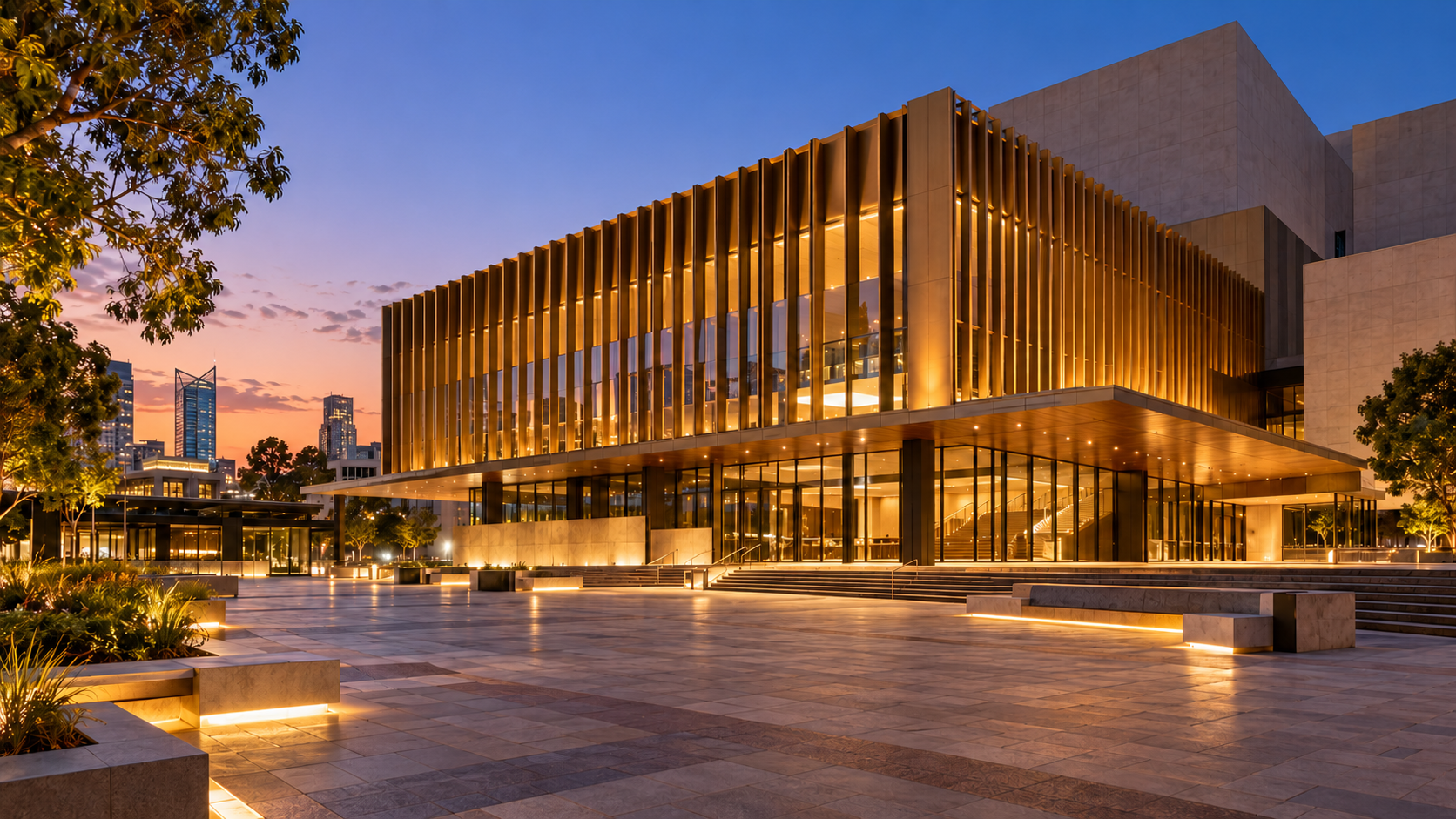 A modern arts building beside a Perth plaza at dusk
