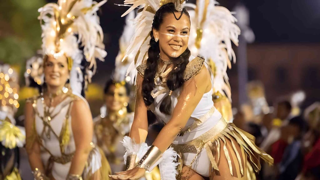 Families enjoying street performances at Nouméa Carnival